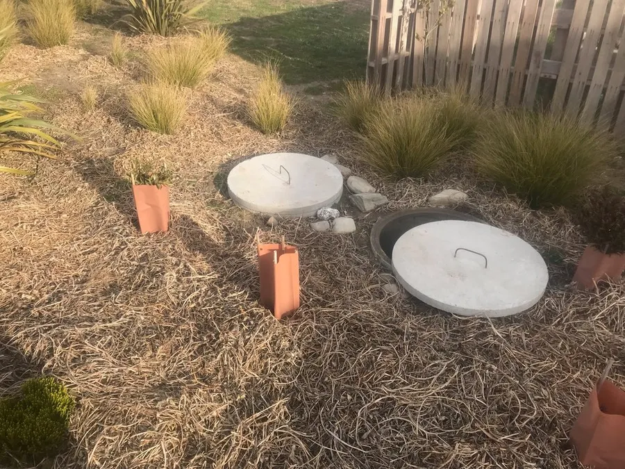 Septic tank access covers in a garden